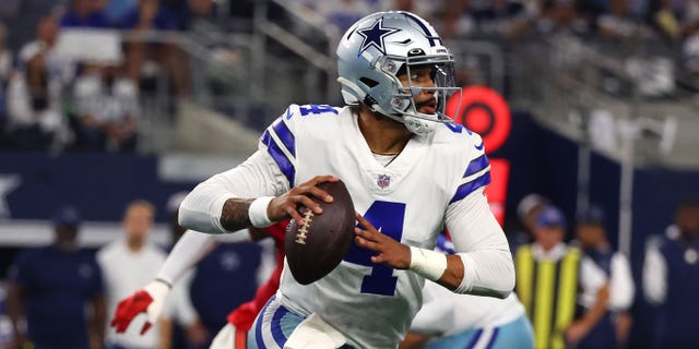 Dak Prescott #4 of the Dallas Cowboys carries the ball against the Tampa Bay Buccaneers during the second half at AT&T Stadium on September 11, 2022 in Arlington, Texas.