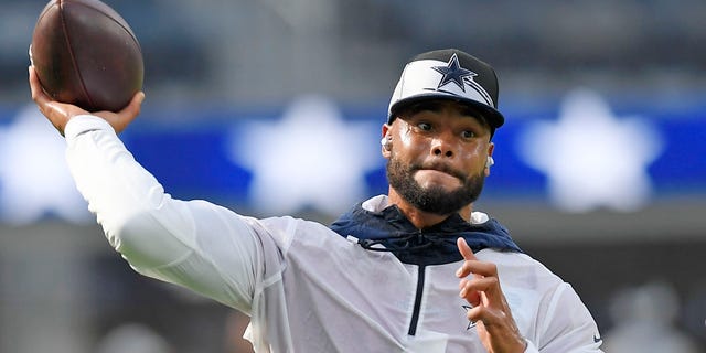 Quarterback Dak Prescott of the Dallas Cowboys warms up before a preseason game against the Los Angeles Chargers at SoFi Stadium in Inglewood, California, on Aug. 20, 2022.