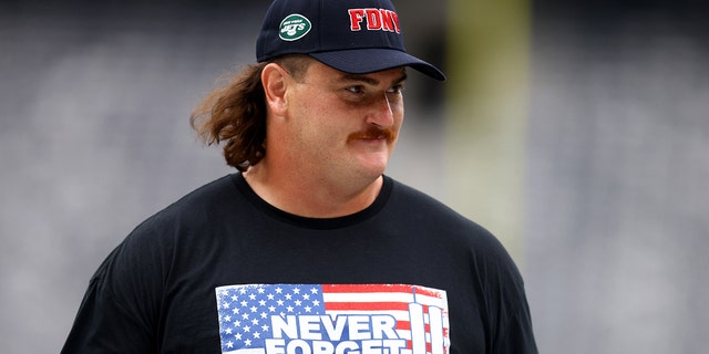 Dan Feeney of the New York Jets honors victims of the 9/11 terrorist attacks at MetLife Stadium on Sept. 11, 2022, in East Rutherford, New Jersey.