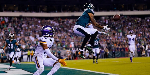 Philadelphia Eagles cornerback Darius Slay intercepts a pass intended for Minnesota Vikings wide receiver Justin Jefferson, left, during the second half of a game on September 19, 2022 in Philadelphia.