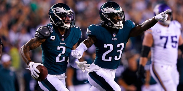 Philadelphia Eagles cornerback Darius Slay (2) intercepts teammate safety CJ Gardner Johnson after intercepting a pass in the second half of an NFL football game against the Minnesota Vikings in Philadelphia on Monday, Sept. 19, 2022. (23) and celebrate. 