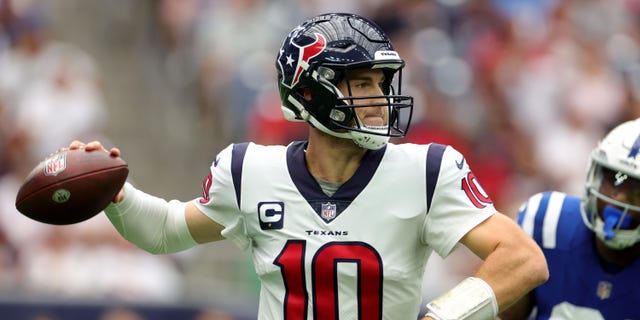 Davis Mills #10 of the Houston Texans looks to pass during the first half against the Indianapolis Colts at NRG Stadium on September 11, 2022 in Houston, Texas.