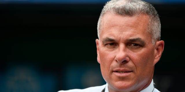 Dayton Moore general manager of the Kansas City Royals watches the batting practice prior to a game against the Cincinnati Reds at Kauffman Stadium on June 12, 2018 in Kansas City, Missouri.