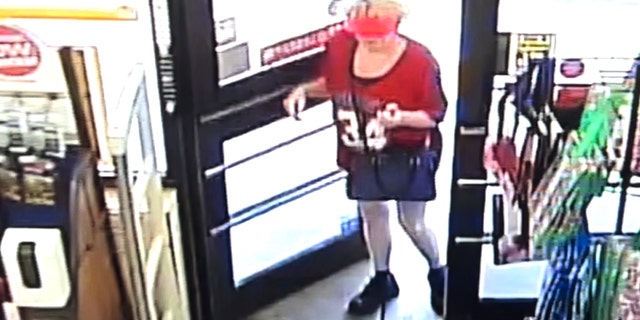 Surveillance video shows Debbie Collier carrying a large black purse and keys as she enters the Family Dollar store in Clayton, Georgia, on Sept. 10, 2022.
