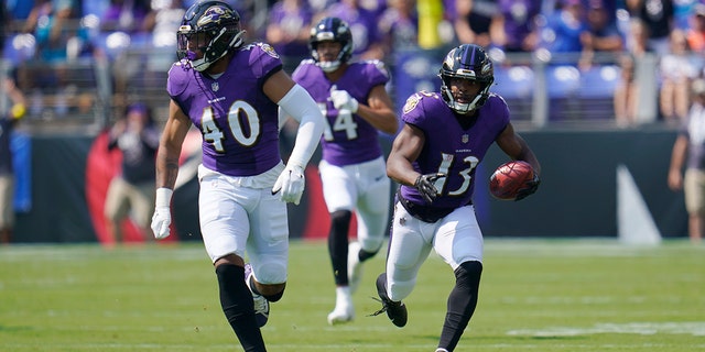 Ravens wide receiver Devin Duvernay scores during the first half against the Miami Dolphins, Sunday, Sept. 18, 2022, in Baltimore.