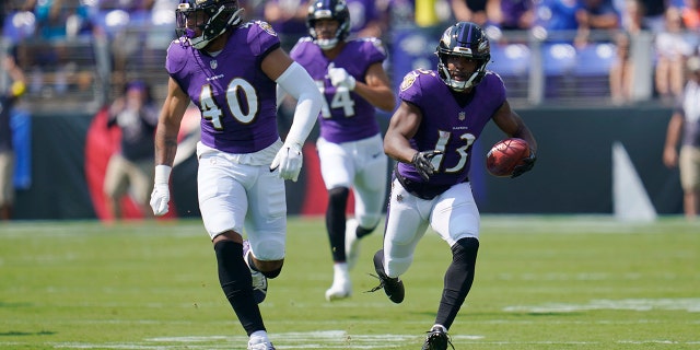 Ravens wide receiver Devin Duvernay scores during the first half against the Miami Dolphins, Sunday, Sept. 18, 2022, in Baltimore.