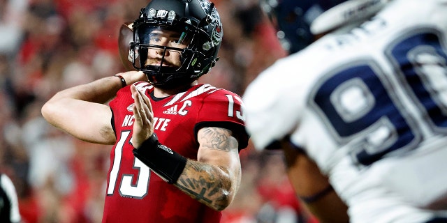 Devin Leary of North Carolina State passes during the first half against Connecticut on September 24, 2022 in Raleigh, North Carolina.