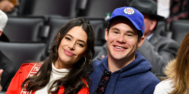 (file photo) Devine on Friday shared a photograph on Instagram Friday of himself and his wife Chloe Bridges, assuring fans that his marriage is "doing great and going strong."