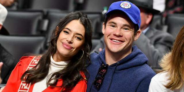 (file photo) Devine on Friday shared a photograph on Instagram Friday of himself and his wife Chloe Bridges, assuring fans that his marriage is "doing great and going strong."