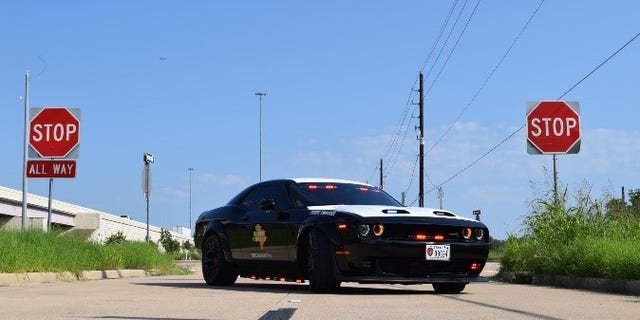 The Dodge was converted into a black and white highway patrol vehicle, equipped with emergency lights and a police radio.