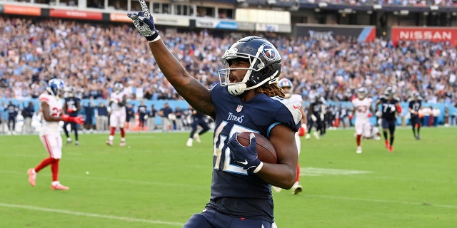 Tennessee Titans running back Dontrell Hilliard (40) celebrates as he runs to the end zone for a touchdown during the second half of an NFL football game against the New York Giants Sunday, Sept. 11, 2022, in Nashville.