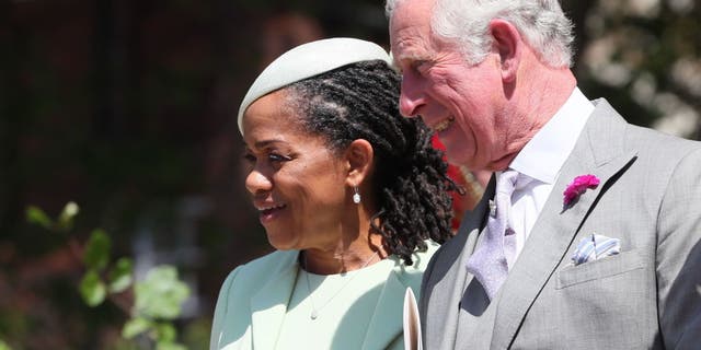 Doria Ragland, Meghan Markle's mother, and then Prince Charles leave St. George's Chapel at Windsor Castle following the wedding of Prince Harry to Meghan Markle on May 19, 2018.