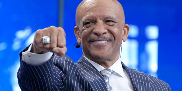 Former Dallas Cowboys wide receiver Drew Pearson shows off his Super Bowl ring during the NFL Draft at AT&T Stadium in Arlington, Texas, on Thursday, April 26, 2018.