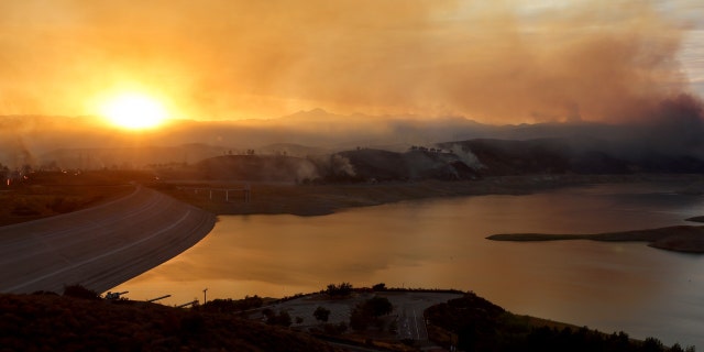 The Route Fire burns near the Castaic Lake reservoir, with a current water level of 48 percent of the historic average for today, amid ongoing drought on Aug. 31, 2022, near Castaic, California.