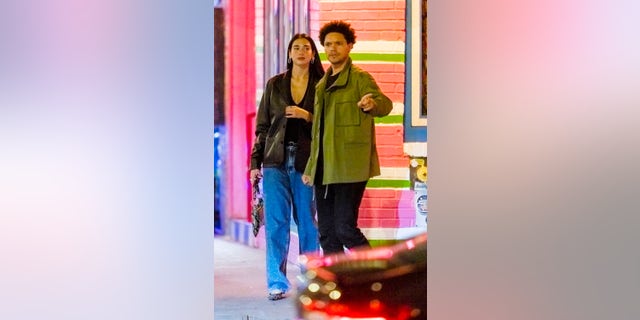 Trevor Noah and Dua Lipa head out for a date night in New York City. They were spotted hugging and kissing in the street after dinner.