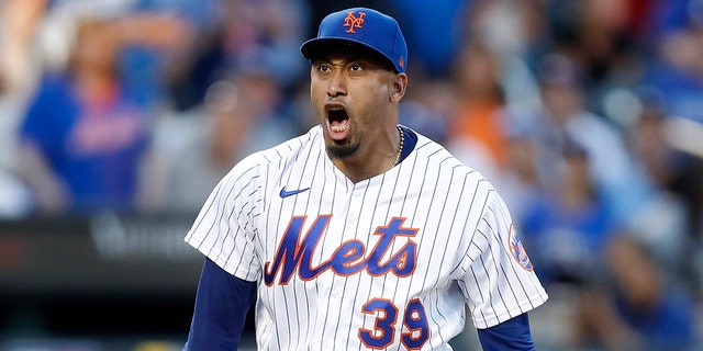 Edwin Diaz #39 of the New York Mets reacts after the eighth inning against the Los Angeles Dodgers at Citi Field on September 01, 2022 in New York City.