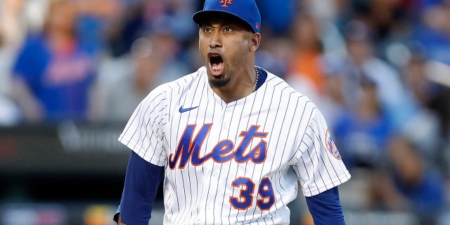 Edwin Diaz #39 of the New York Mets reacts after the eighth inning against the Los Angeles Dodgers at Citi Field on September 01, 2022 in New York City.