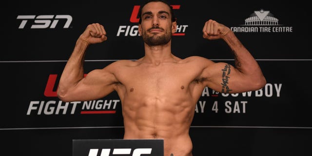 Elias Theodorou of Canada poses on the scale during the UFC Fight Night weigh-in at Andaz Ottawa Byward Market on May 3, 2019 in Ottawa, Ontario, Canada.