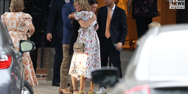 Eliza Fletcher's mother, Adele Wellford, and husband, Richard Fletcher, seen with mourners as they gather at the Second Presbyterian Church in Memphis, Tennessee, on September 10, 2022, for the funeral service for Eliza Fletcher.