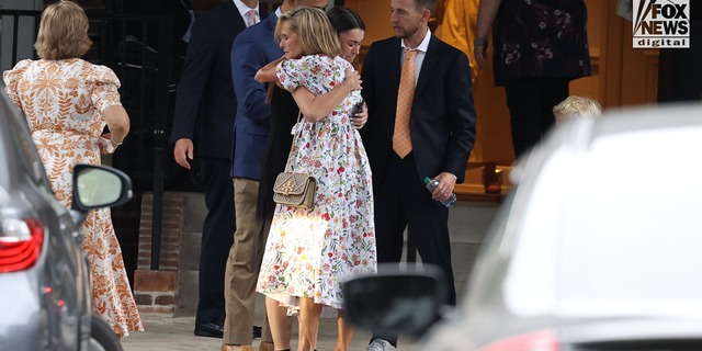 Eliza Fletcher's mother, Adele Wellford, and husband, Richard Fletcher, seen with mourners as they gather at the Second Presbyterian Church in Memphis, Tennessee, on September 10, 2022, for the funeral service for Eliza Fletcher.