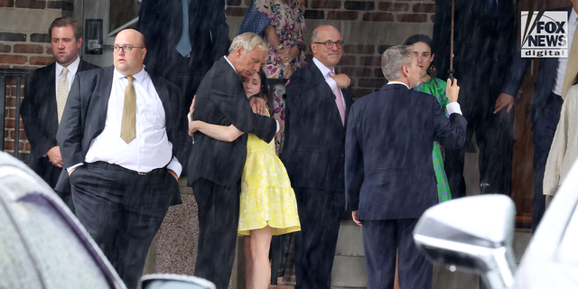 Eliza Fletcher's father, James Beasley, and mourners gather at the Second Presbyterian Church in Memphis, Tennessee, on September 10, 2022, for her funeral service.