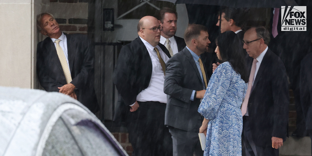 Eliza Fletcher's father leans against a wall as mourners gather at the Second Presbyterian Church in Memphis, Tennessee, on September 10, 2022, for the funeral service for Eliza Fletcher.