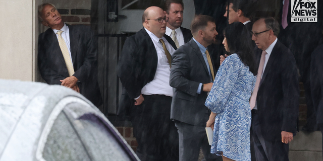 Eliza Fletcher's father leans against a wall as mourners gather at the Second Presbyterian Church in Memphis, Tennessee, on September 10, 2022, for the funeral service for Eliza Fletcher.