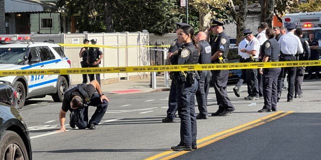 New York City police at a crime scene in the Astoria neighborhood of Queens where FDNY paramedic Lt. Alison Russo-Elling was fatally stabbed on Thursday.