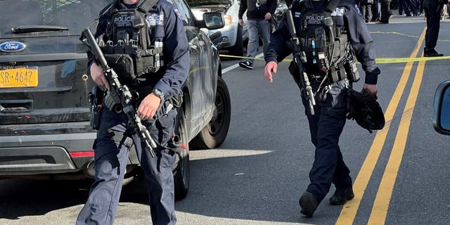 New York City tactical police arrive on scene in Queens to apprehend the suspect in the fatal stabbing of FDNY paramedic Lt. Alison Russo-Elling.
