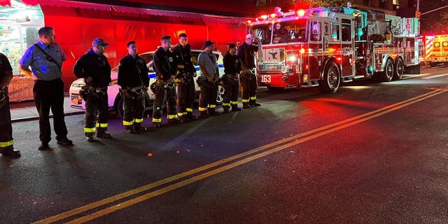 New York City firefighters line the street for the procession carrying the body of FDNY paramedic Lt. Alison Russo-Elling, who was fatally stabbed in the line of duty in Queens Thursday.