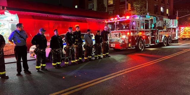 New York City firefighters line the street for the procession carrying the body of FDNY paramedic Lt. Alison Russo-Elling, who was fatally stabbed in the line of duty in Queens Thursday.