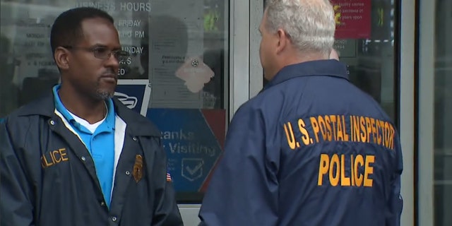 U.S. Postal Police on the scene investigating. 