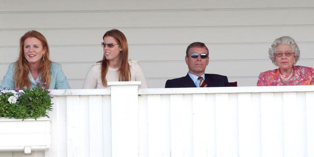 Sarah Ferguson, Queen Elizabeth II and others watch a polo match in 2004.