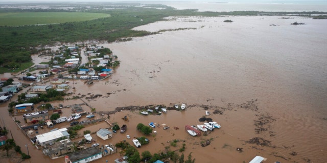 Homes are flooded on Salinas Beach after the passing of Hurricane Fiona in Salinas, Puerto Rico, Monday, Sept. 19, 2022.