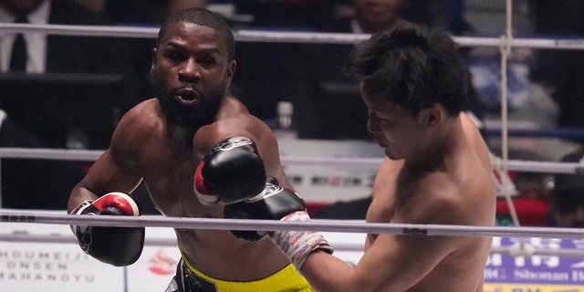 Floyd Mayweather throws a punch against Mikuru Asakura, Sunday, Sept. 25, 2022.