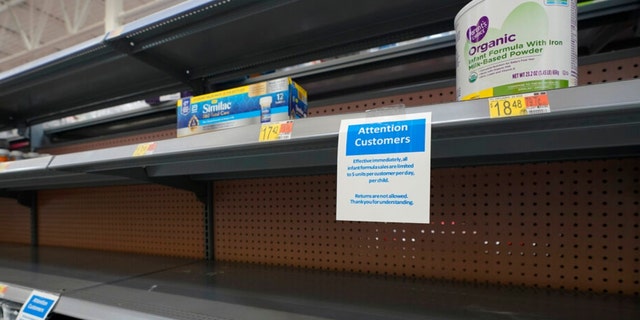 Shelves usually stocked with infant formula lie mostly empty at a store in San Antonio, Texas on May 10, 2022.
