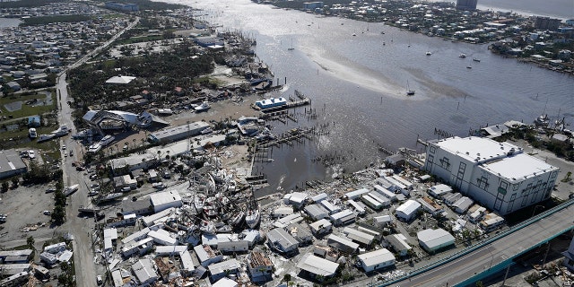 A boat, damaged in the aftermath of Hurricane Ian in Fort, lies on land and in the water. Myers, Florida. The mental trauma of enduring bad weather like a hurricane "really, really devastating" Dr Nesheiwat said.