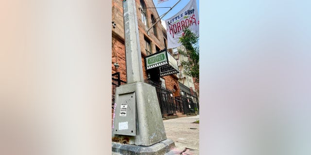 Westside Theatre in New York City has been the home since 2019 of "Little Shop of Hours," a popular Theater District tourist attraction. A man slept in filth just outside the theater on Sunday Sept. 11, 2022 and used a New York City utility pole for his toaster oven.