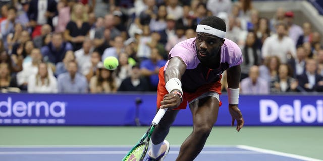 Frances Tiafoe of the United States returns a shot against Carlos Alcaraz of Spain during their Men’s Singles Semifinal match on Day Twelve of the 2022 US Open at USTA Billie Jean King National Tennis Center on September 09, 2022 in the Flushing neighborhood of the Queens borough of New York City.