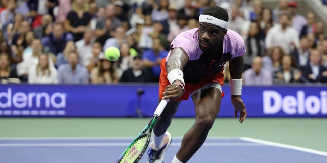 Frances Tiafoe of the United States returns a shot against Carlos Alcaraz of Spain during their Men’s Singles Semifinal match on Day Twelve of the 2022 US Open at USTA Billie Jean King National Tennis Center on September 09, 2022 in the Flushing neighborhood of the Queens borough of New York City.