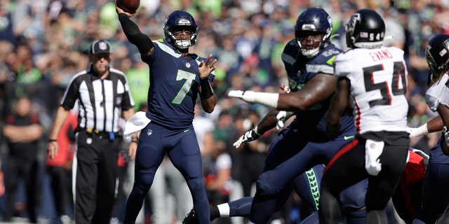 Seattle Seahawks quarterback Genno Smith throws a pass during the first half of an NFL football game against the Atlanta Falcons in Seattle on September 25, 2022. 