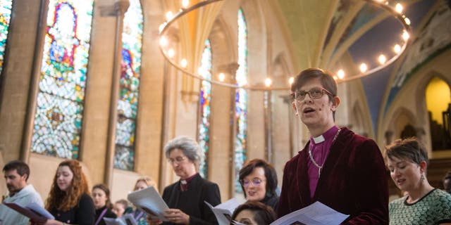 The Bishop of Derby right Rev. Libby Lane, second right, sings at a celebration service to mark the 25th anniversary of women's ordination into the Church of England, at Lambeth Palace, London.