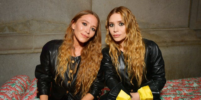The Olsen twins were photographed alongside model Rosanna Ovalles Robles at their fashion show for The Row at Paris Fashion Week.