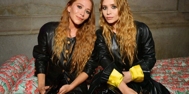 The Olsen twins were photographed alongside model Rosanna Ovalez Robles at The Row fashion show during Paris Fashion Week.