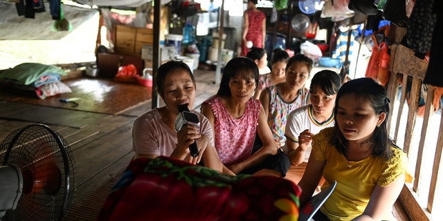 Karaoke is a popular form of entertainment in Vietnam, as seen in this 2019 photo of migrant workers singing karaoke in their downtime. 