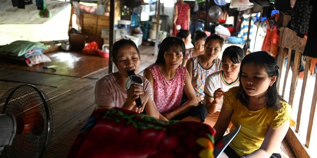 Karaoke is a popular form of entertainment in Vietnam, as seen in this 2019 photo of migrant workers singing karaoke in their downtime. 