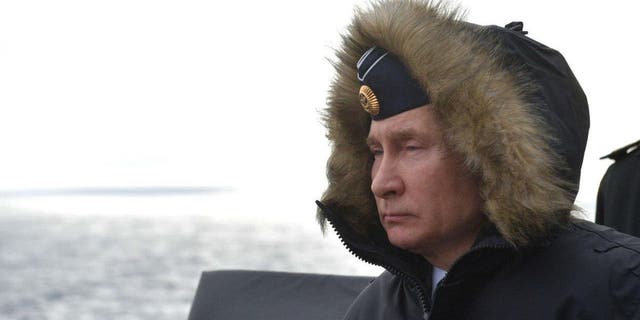 Russian President Vladimir Putin watches a naval exercise from the Marshal Ustinov missile cruiser in the Black Sea on January 09, 2020. 