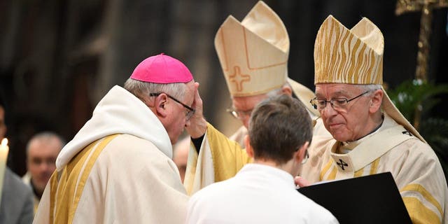 Archbishop Jozef De Kesel (R) crosses the forehead of the new Bishop of Gent Lode Van Hecke (L) during his ordination and installation at the Sint-Baafskathedraal cathedral in Gent on February 23, 2020. (Photo by YORICK JANSENS / BELGA / AFP) / Belgium OUT (Photo by YORICK JANSENS/BELGA/AFP via Getty Images)