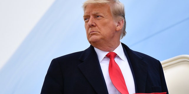US President Donald Trump boards Air Force One before departing Harlingen, Texas on January 12, 2021. (Photo by MANDEL NGAN / AFP) (Photo by MANDEL NGAN/AFP via Getty Images)