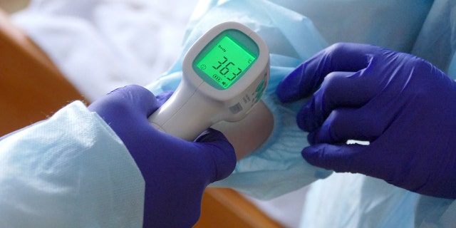 IVANO-FRANKIVSK, UKRAINE - FEBRUARY 23, 2021 - A contactless thermometer at the Regional Clinical Hospital of the Ivano-Frankivsk Regional Council that treats people with COVID-19, Ivano-Frankivsk, western Ukraine. 